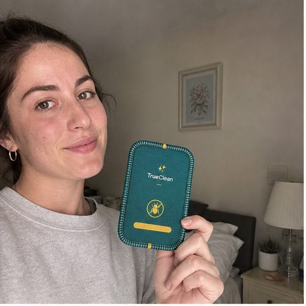 Customer holding CaptureCards near her bed